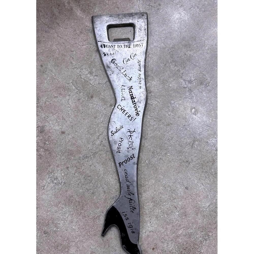 VTG Long Leg w/ Heel Toast in languages to the Host Bottle Opener Rare Aluminum